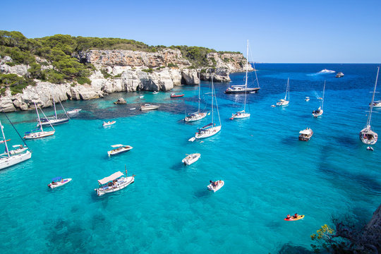 Fototapeta Boats and yachts on Macarella beach, Menorca, Spain