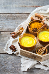 Traditional indian drink turmeric curcuma golden milk with ingredients