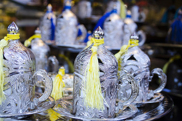 Turkish coffee cups with silver and copper covers. shallow depth of field; in istanbul bazaar