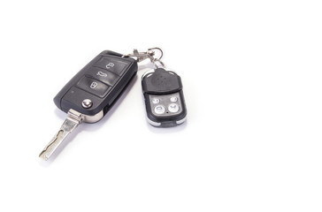 Car key with garage remote control on the white