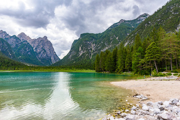 Naklejka na ściany i meble Lake Dobbiaco (Toblacher See, Lago di Dobbiaco) in Dolomite Alps, South Tirol, Italy - Travel destination in Europe