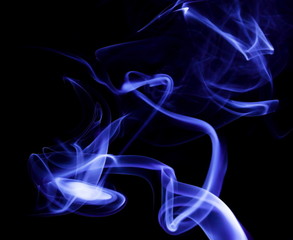 Fototapeta premium Blue smoke on black background