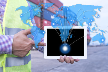World wide logistic, Hand holding tablet with world link connection in front Logistics Industrial Container Cargo freight ship for Concept of fast or instant shipping, Online goods orders worldwide