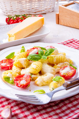 delicious gnocchi with gorgonzola cream sauce and cherry tomatoes