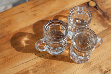 soda spritzer drink refreshment. Three Glass cup of white wine on wooden table in Vineyards in Heuriger tavern in Eastern Austria, where a local winemaker serves his new wine. Top view
