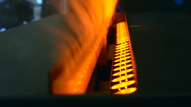 Electric fireplaces with built-in evaporator converts water into steam, which simulates smoke sideways close-up from the inside. Model with 3D effect. Energy saving innovation