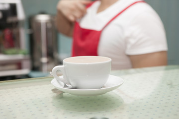 A cup of coffee on the bar counter