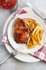 pork steak on dice with potatoes