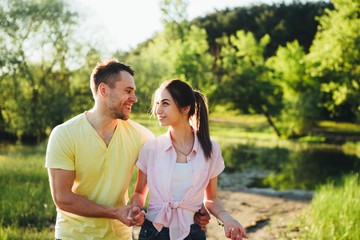 Shot of a young couple bonding trough walking in the nature.
