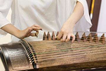 Playing the zither's moment