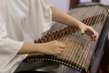 Playing the zither's moment