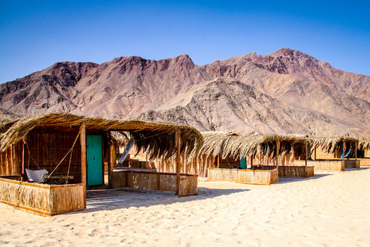 Simple bungalow style shacks at a desert beach resort in Nuweiba on the Red Sea coast of Egypt's Sinai Peninsula