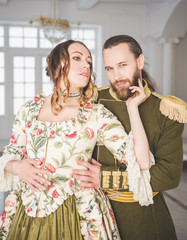 Beautiful couple man and woman in medieval costumes