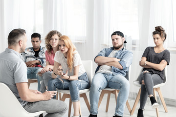 Group of teenagers asking their teacher for help with a difficult situation. Bullying at school...