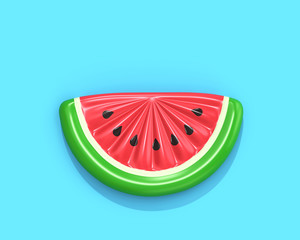 Inflatable watermelon slice on blue background with clipping path