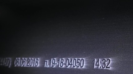 Laser Marking Machine Engraving. Manufacture of plastic water pipes of the factory. Process of making plastic tubes on the machine tool with the use of water and air pressure.