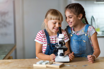 Girls with microscope

