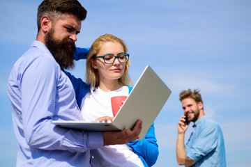 Fresh air helps to refresh mind. Colleagues laptop work outdoor sunny day, sky background. Friends enjoy fresh air and keep working. Outdoor workspace concept. Colleagues with laptop discussing plan