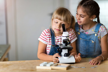 Girls with microscope
