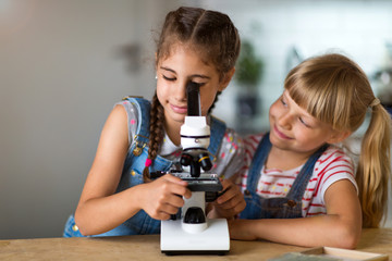 Girls with microscope
