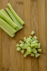 Sliced cucumber on wooden board