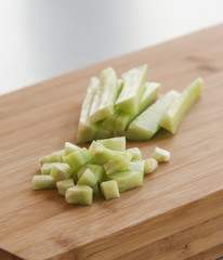 Sliced cucumber on wooden board