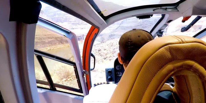 Helicopter pilot preparing for take off in cockpit, Grand Canyon, Las Vegas