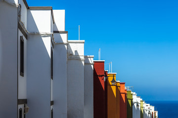 Multicolored houses on island Tenerife, Spain, side view.