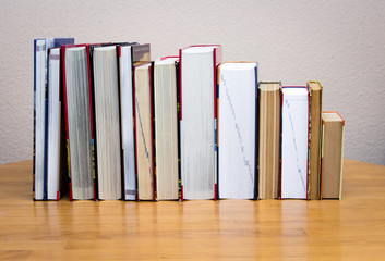 piles of books on the table.