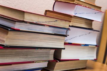 piles of books on the table.