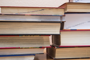 piles of books on the table.