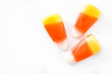 Typical halloween candy corn isolated on white background. Top view. Close up