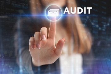 The concept of business, technology, the Internet and the network. A young entrepreneur working on a virtual screen of the future and sees the inscription: Audit