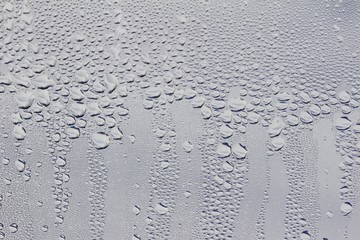 Macro view of water droplets condensation on a window pane