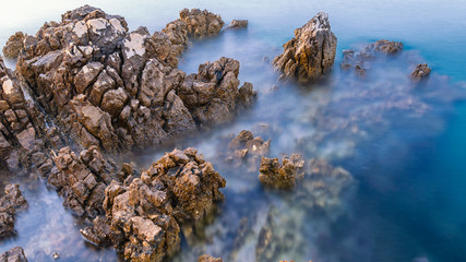 Long exposure of sea rocks during sunset