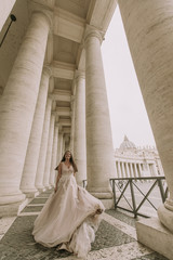 Pretty young bride in wedding dress in the Vatican