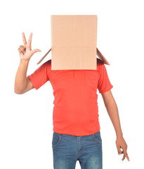 Young man gesturing with a cardboard box on his head isolated on white background