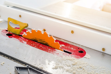 Woodworking, adjustable circular saw in the workshop