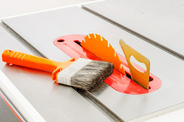 Woodworking, adjustable circular saw in the workshop
