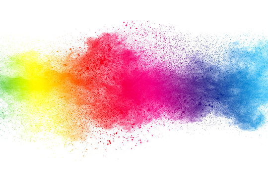 Abstract multi color powder explosion on white background.  Freeze motion of  dust  particles splashing. Painted Holi in festival.