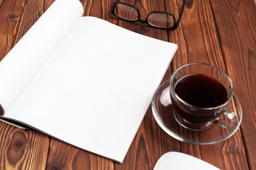 Open blank journal pages for your design copy space on wooden background