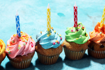 Tasty cupcakes on table. Birthday cupcake in rainbow colors.