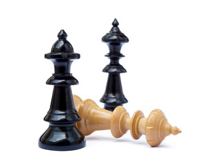 Old chess pieces isolated on white background