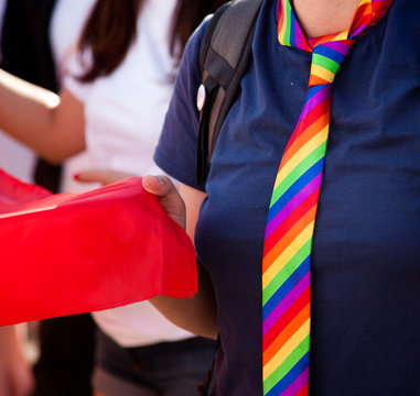 wearing rainbow necktie at pride parade