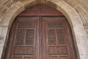 Cosenza, Italy - June 13, 2018 : Entrace wood door of San Domenico church