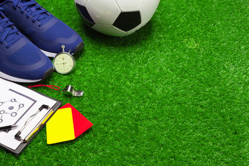 Football boots and ball