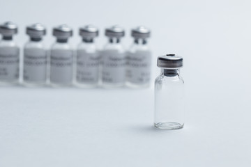 vial and syringe for vaccine on white background closeup