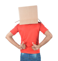 Young man gesturing with a cardboard box on his head isolated on white background