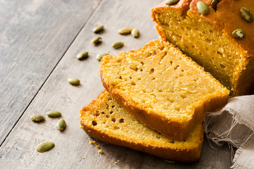 Homemade pumpkin bread on wooden table. Copyspace