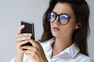 Young businesswoman is using smartphone